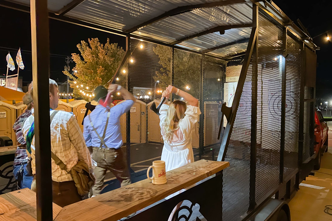 Image of man and woman axe throwing